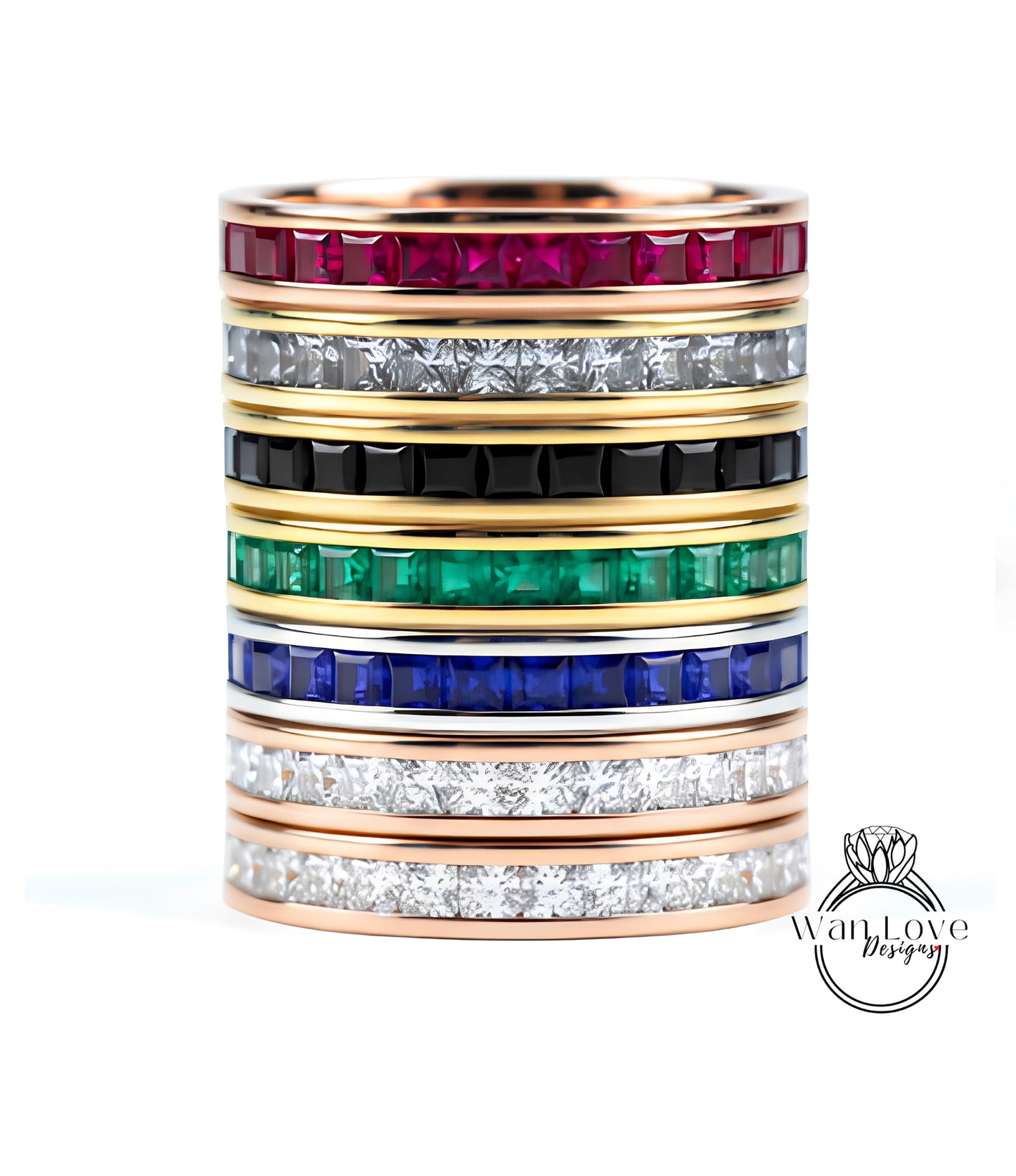 A stack of rings with various colored gemstones set in gold bands.
