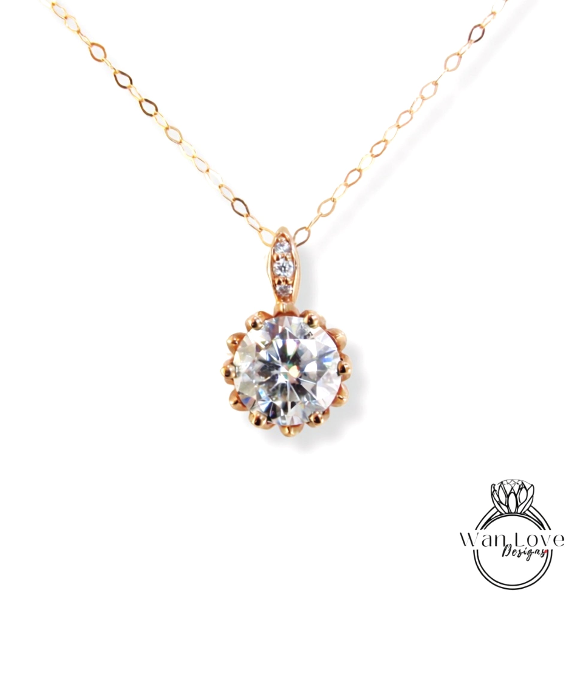 A necklace with a large, clear gemstone pendant, possibly a diamond, suspended from a gold chain.