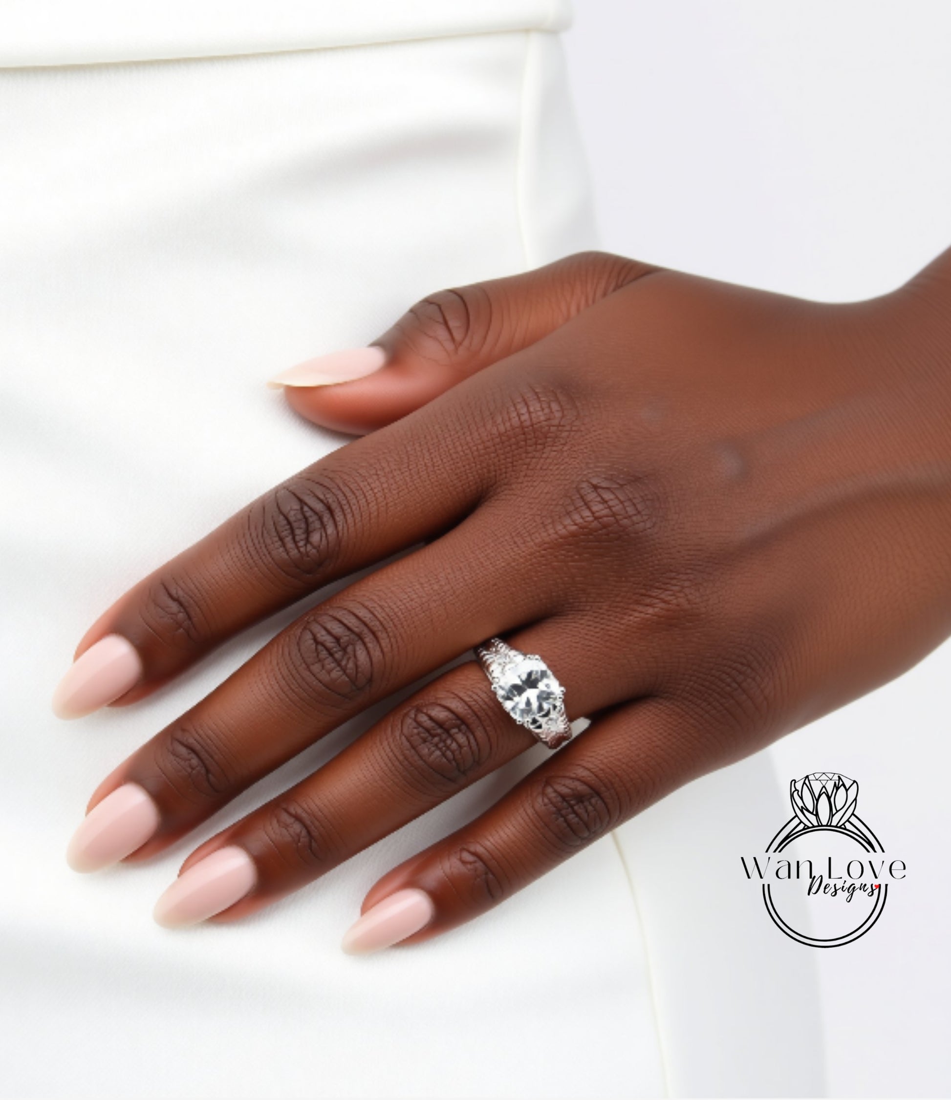 A close-up of a hand wearing a large diamond engagement ring.