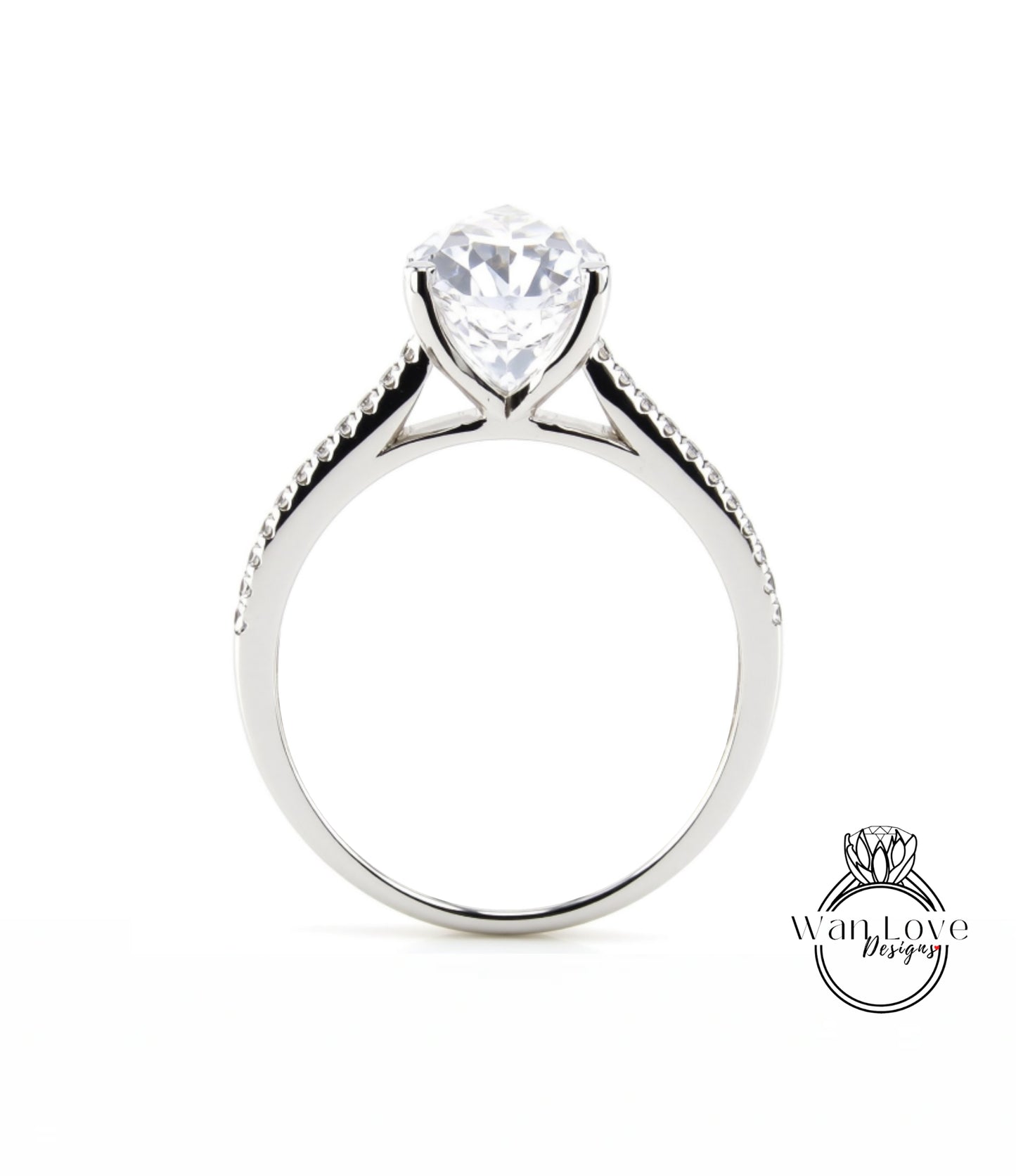 A silver engagement ring with a large, clear gemstone set in the center of the band.