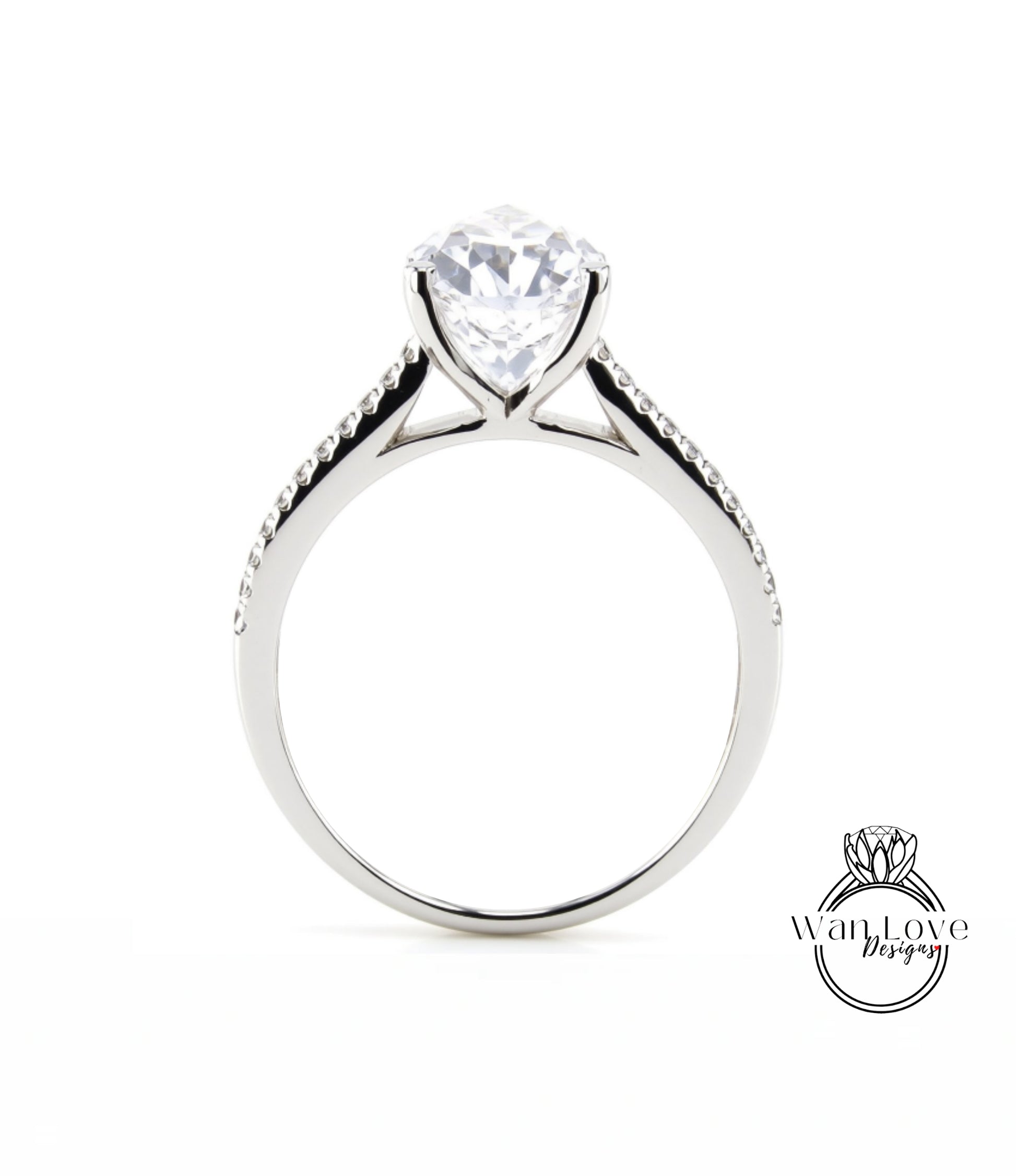 A silver engagement ring with a large, clear gemstone set in the center of the band.