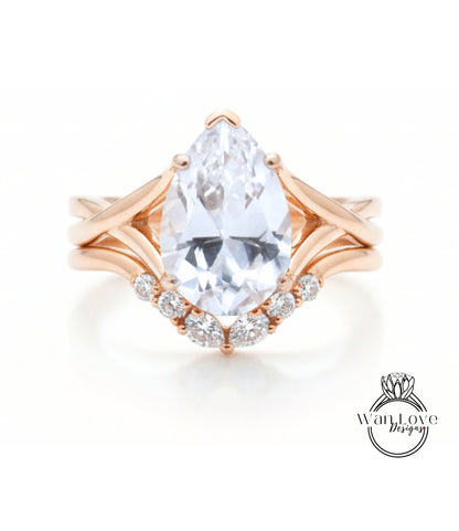 a beautiful engagement ring with a large pear-shaped diamond set in a rose gold band.