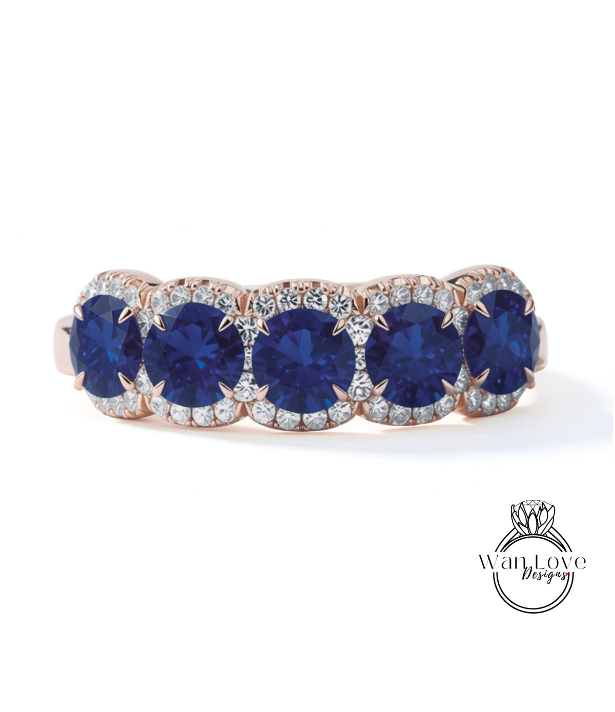 A ring with a row of blue sapphire gemstones set in a rose gold band.