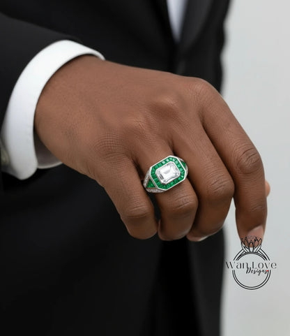 A close-up of a person's hand wearing a ring with a large green gemstone.