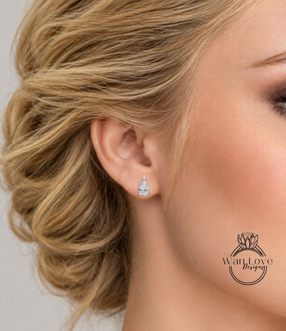 A close-up of a woman's ear with a diamond earring, showcasing the earring and the woman's face.