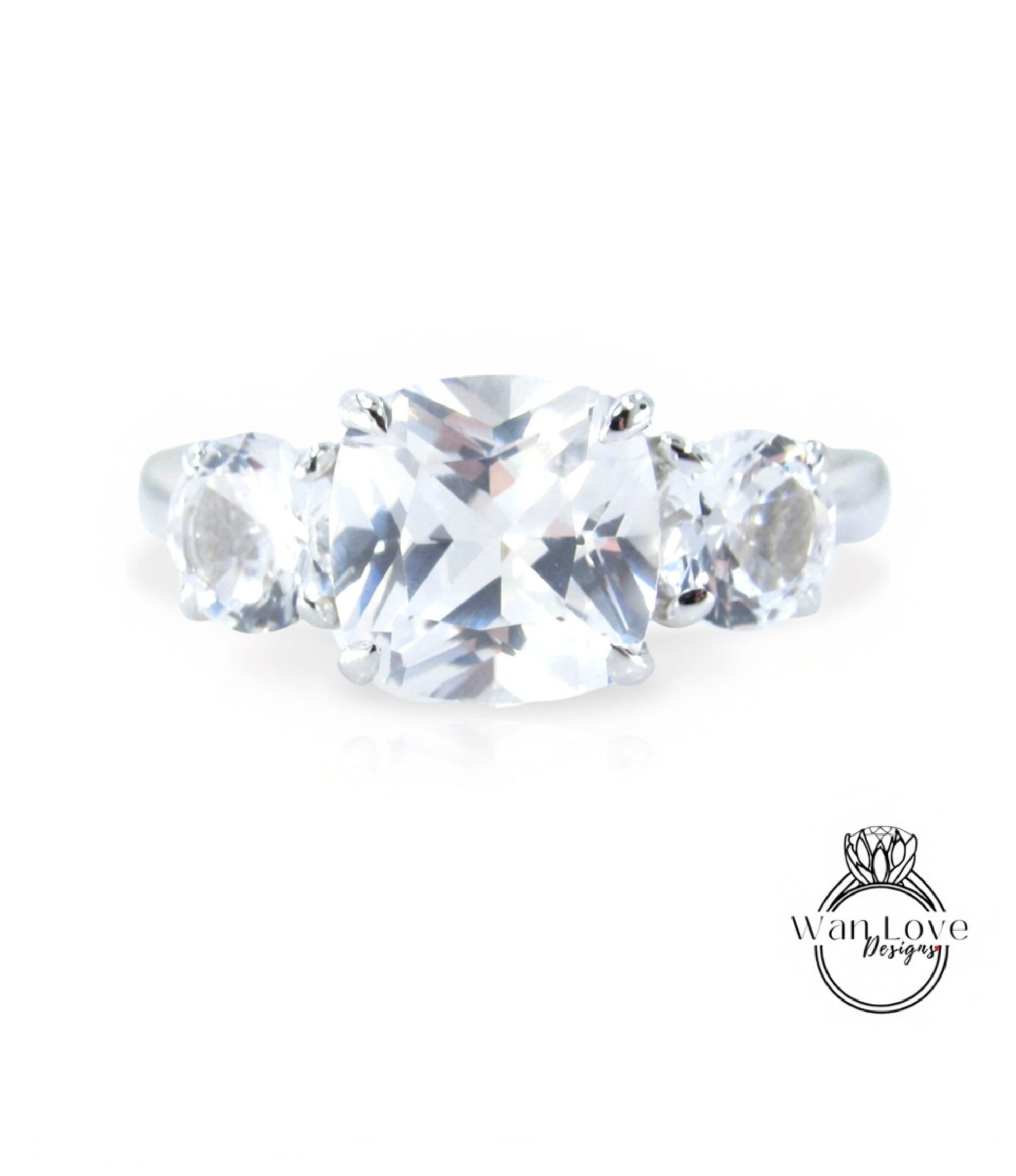 A close-up view of a diamond engagement ring with a large, clear gemstone set in a silver band.