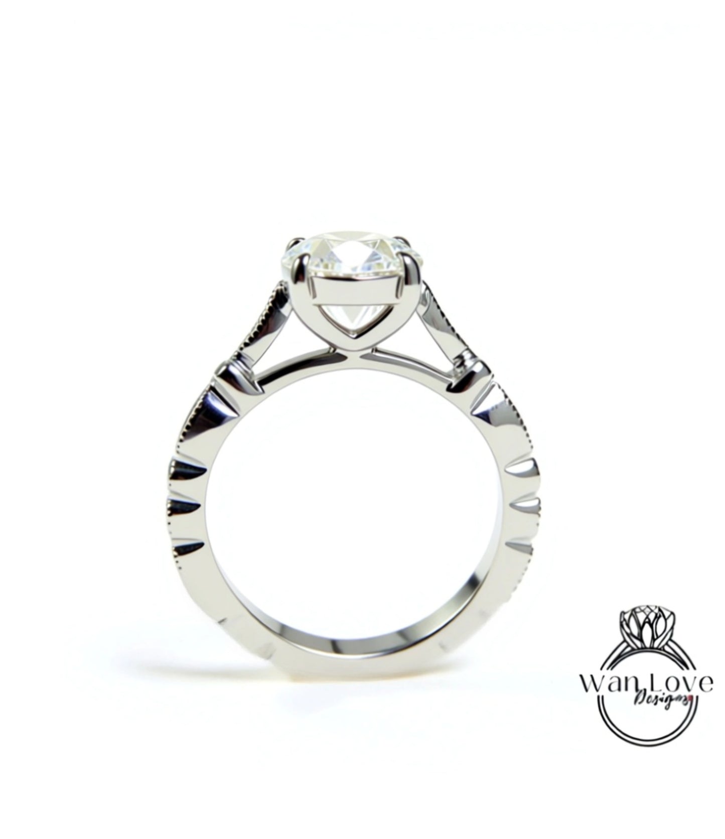 A close-up view of a silver engagement ring with a large central diamond and intricate metalwork detailing.