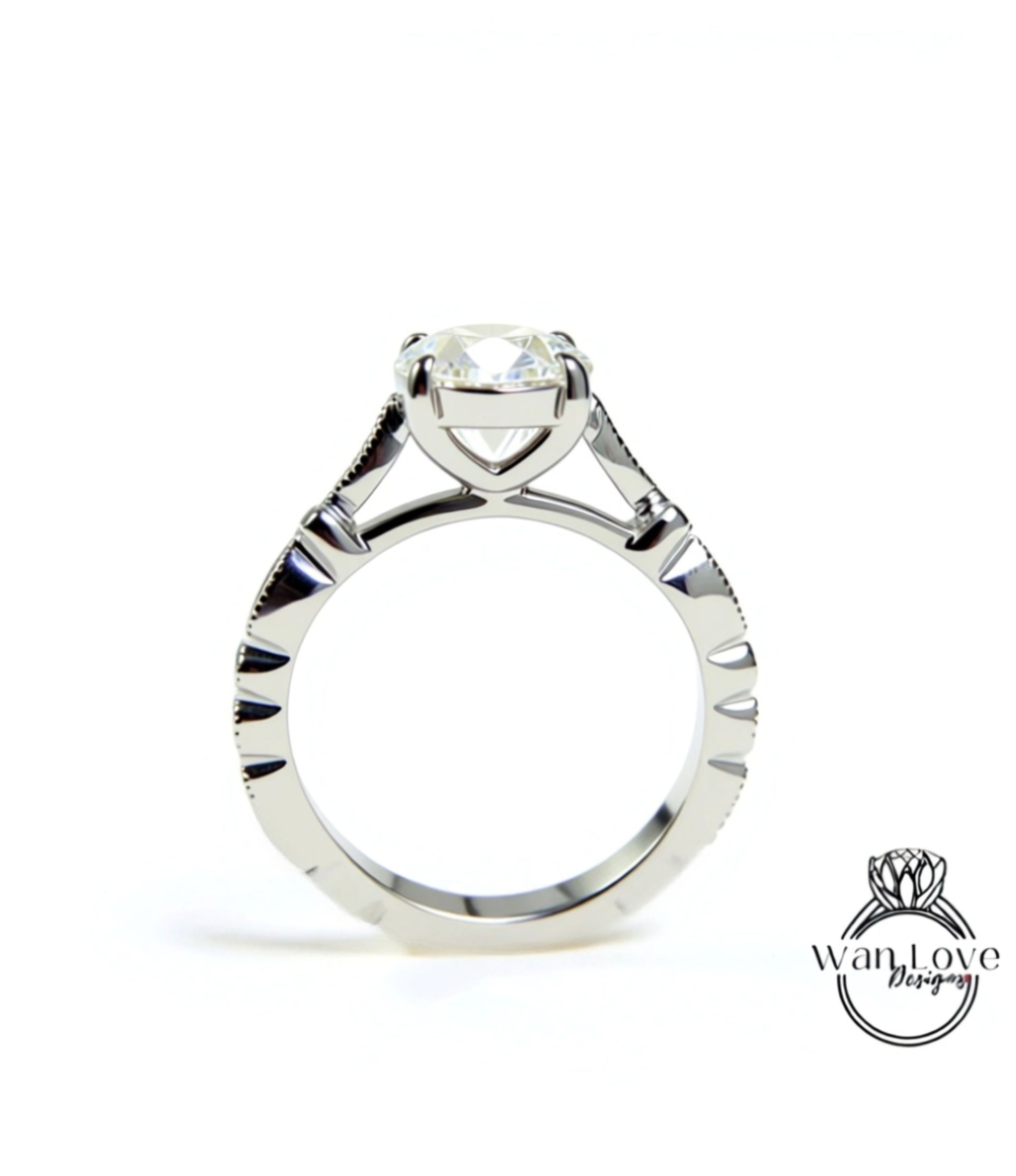 A close-up view of a silver engagement ring with a large central diamond and intricate metalwork detailing.