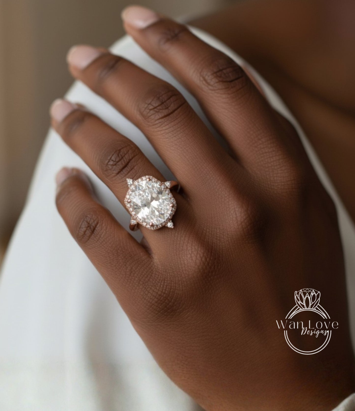 A close-up of a hand wearing a large, sparkling diamond engagement ring.