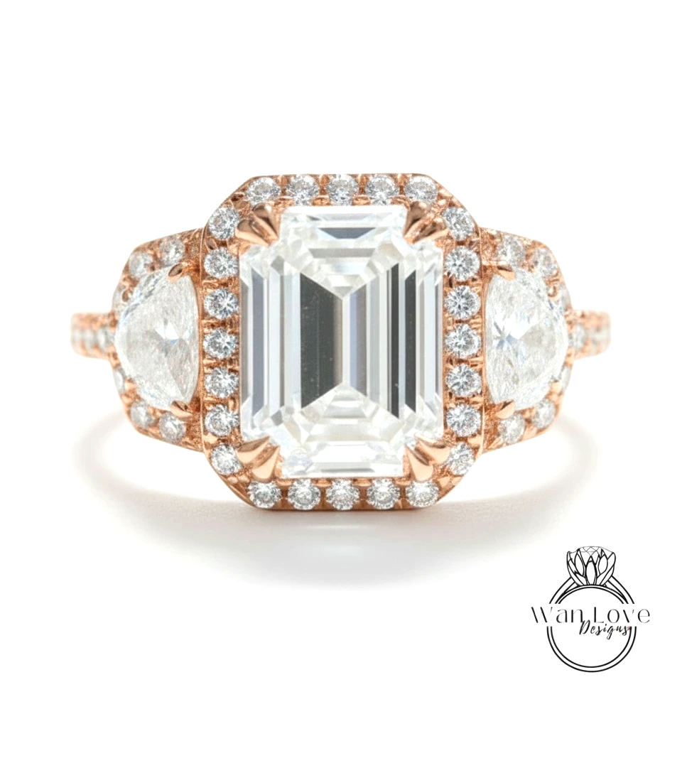 A large, elegant engagement ring with a large central diamond surrounded by smaller diamonds on either side.