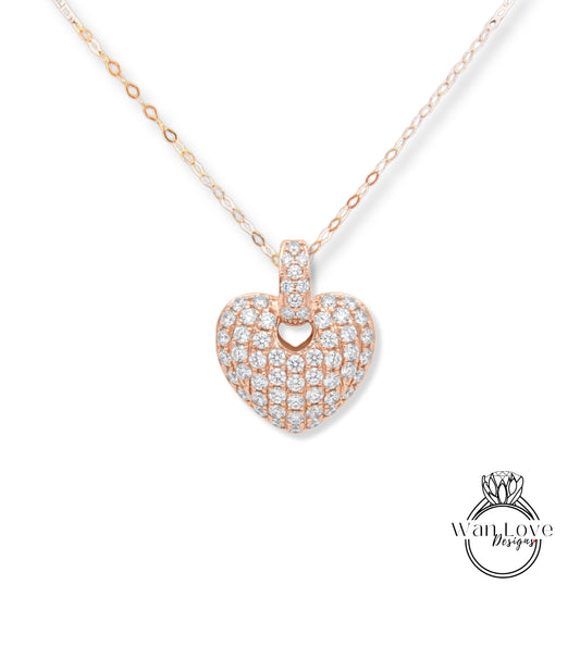 A necklace with a heart-shaped pendant made of small diamonds.