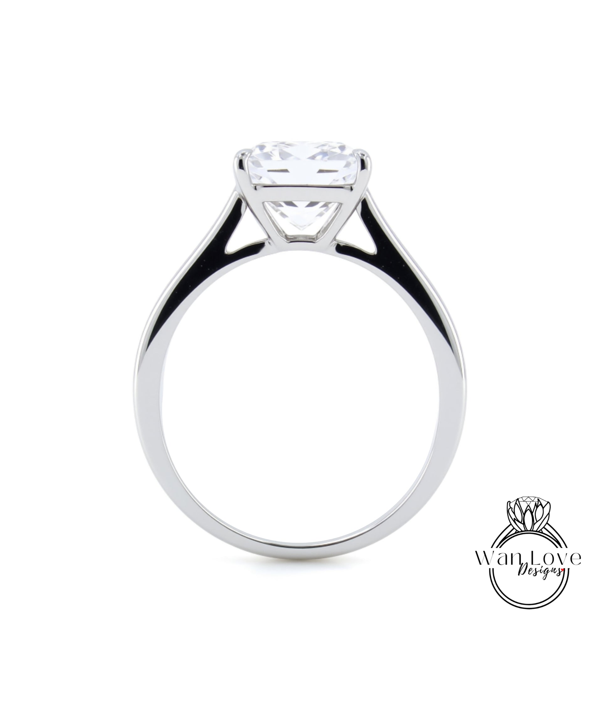 A silver engagement ring with a large, clear gemstone set in the center of the band.