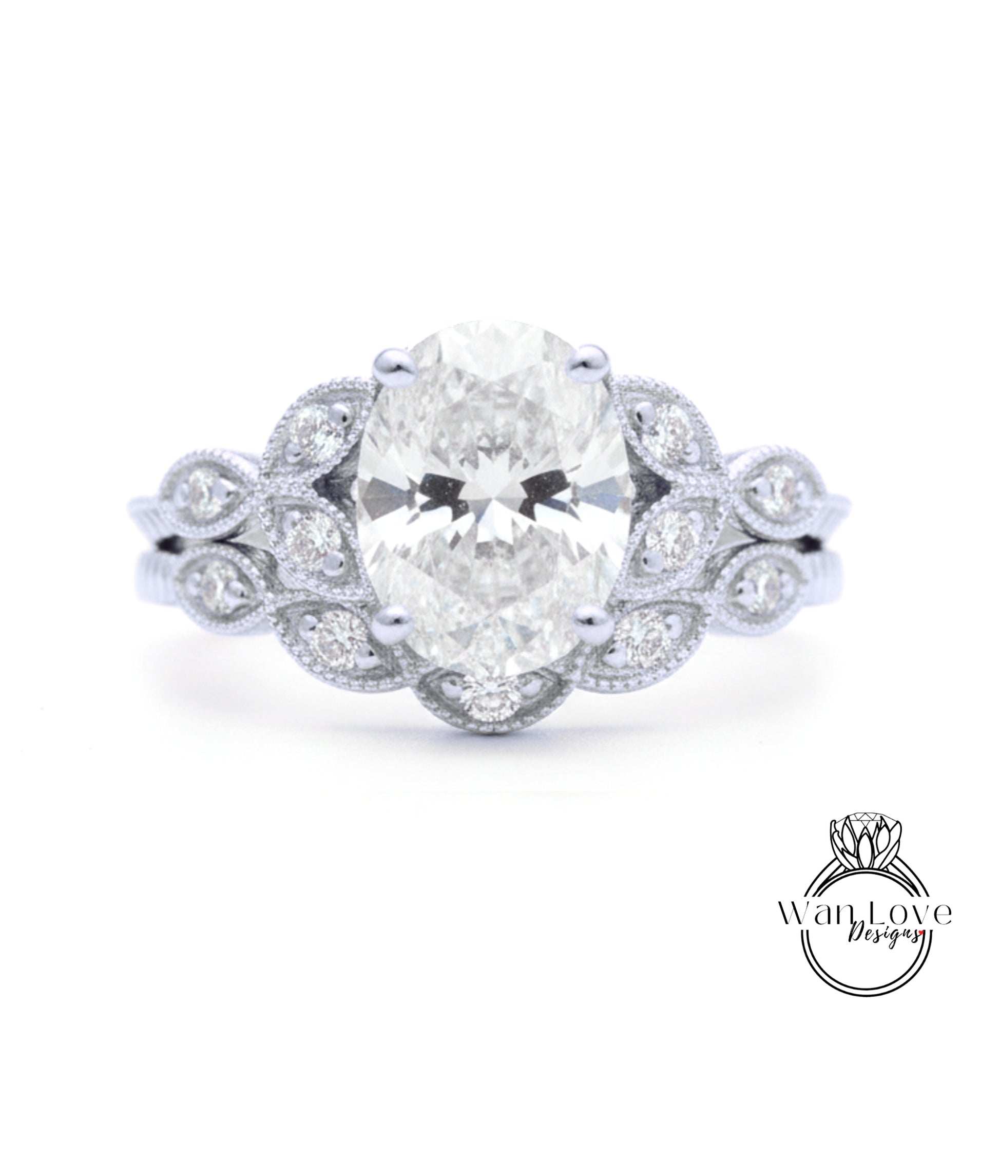 A close-up of a diamond engagement ring with a large oval-shaped diamond surrounded by smaller diamonds and a floral-inspired design.