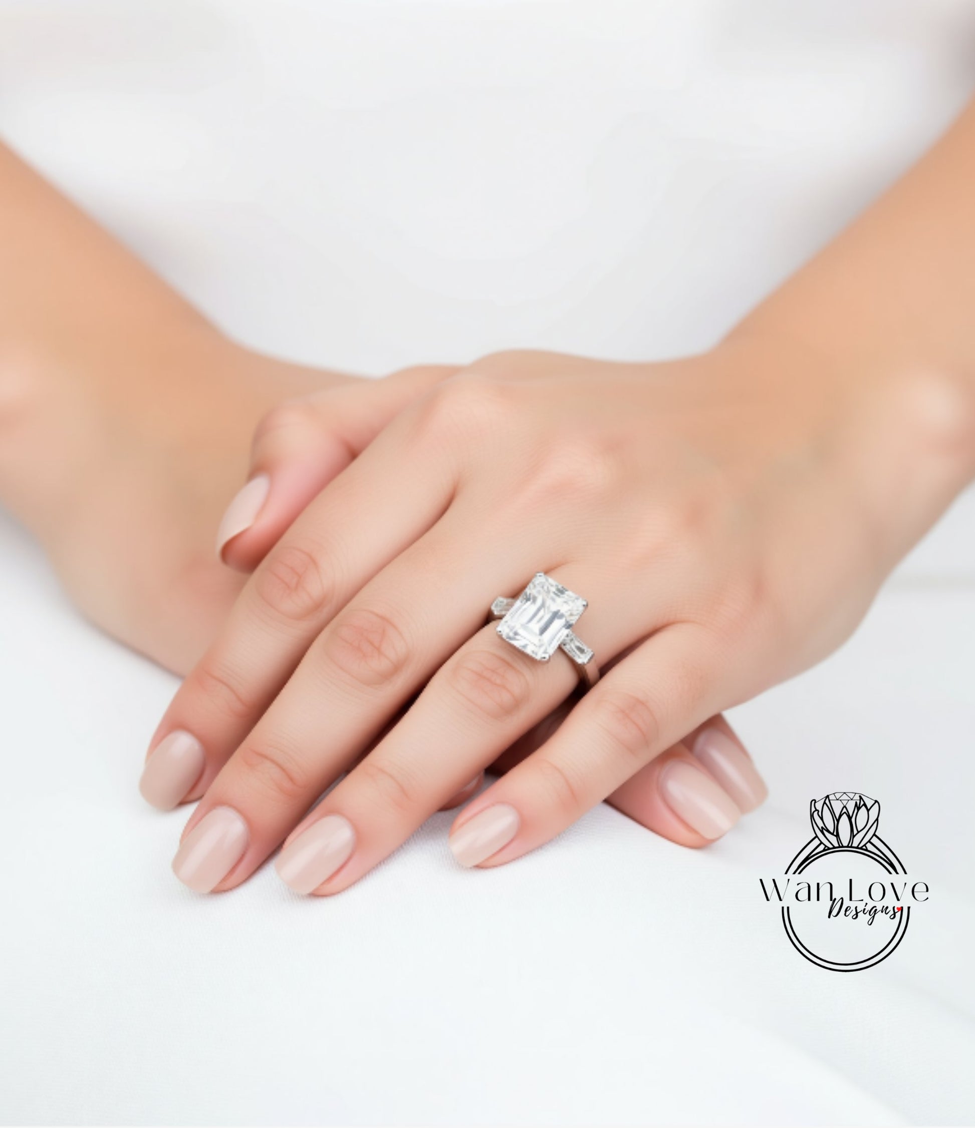 A close-up of a person's hand wearing a large, sparkling diamond engagement ring.