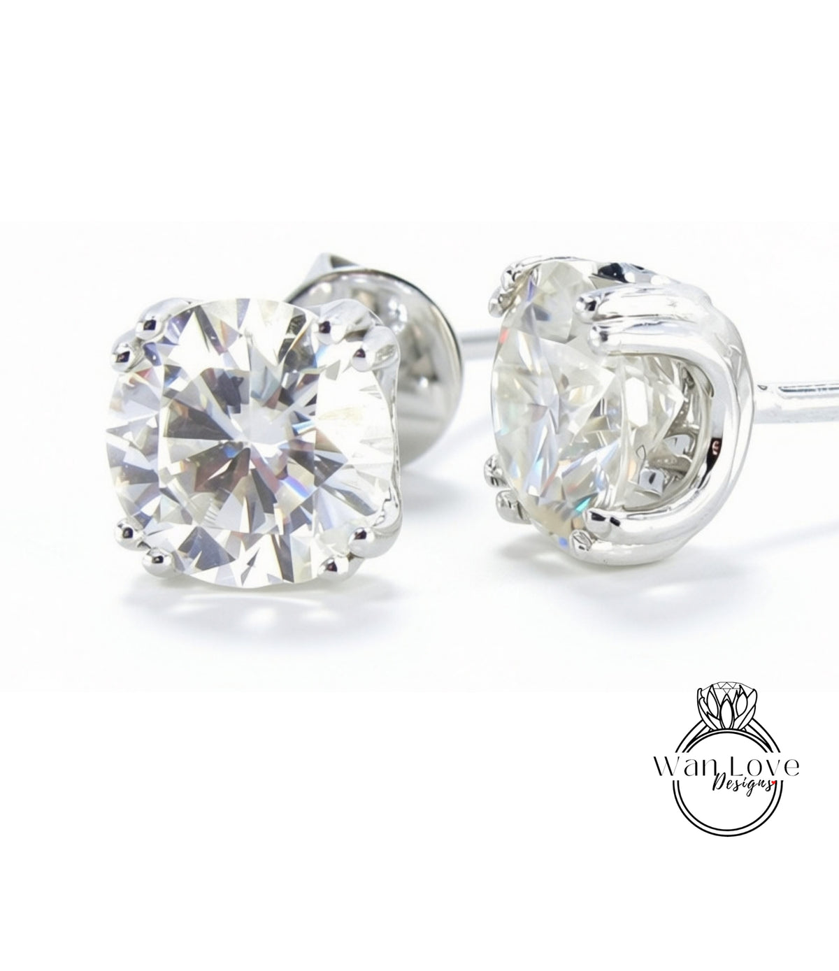 A pair of elegant earrings with large, clear diamonds set in a silver metal frame.