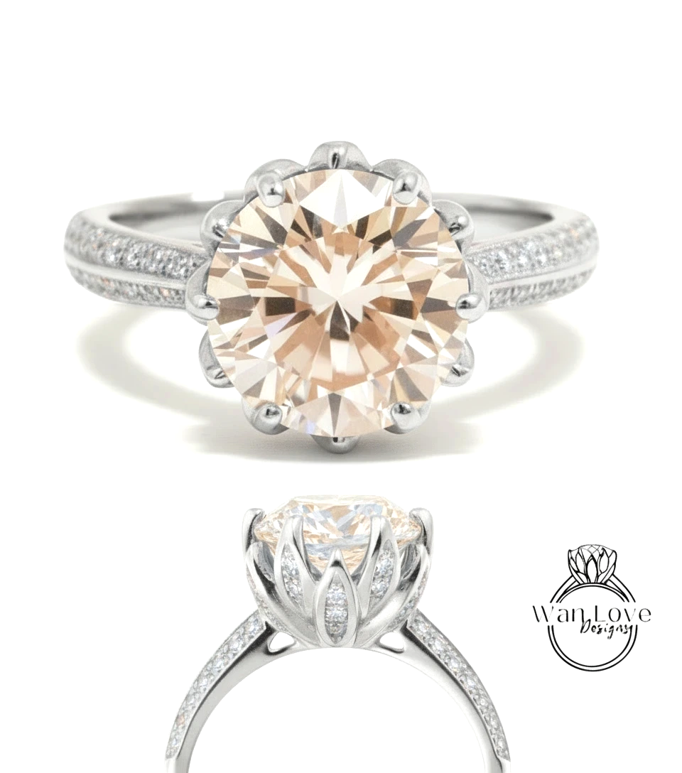 A large, round, light brown diamond engagement ring with a silver band and sparkling diamonds.