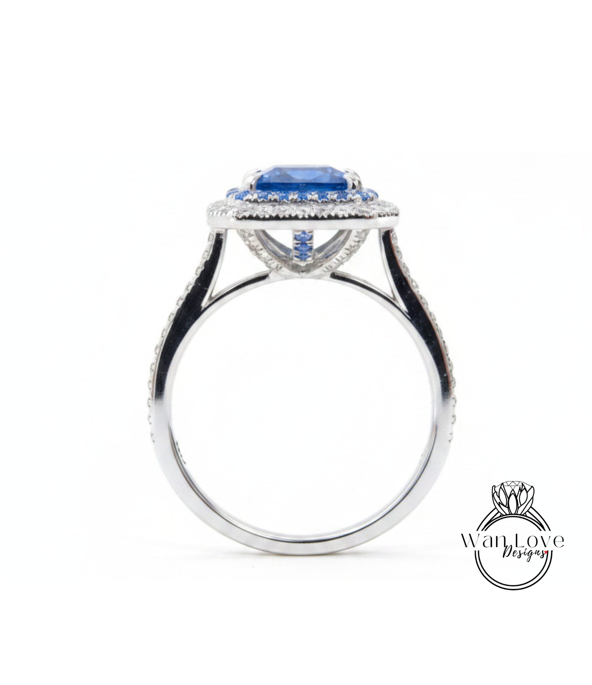 A silver ring with a large blue gemstone at the center, surrounded by smaller diamonds.