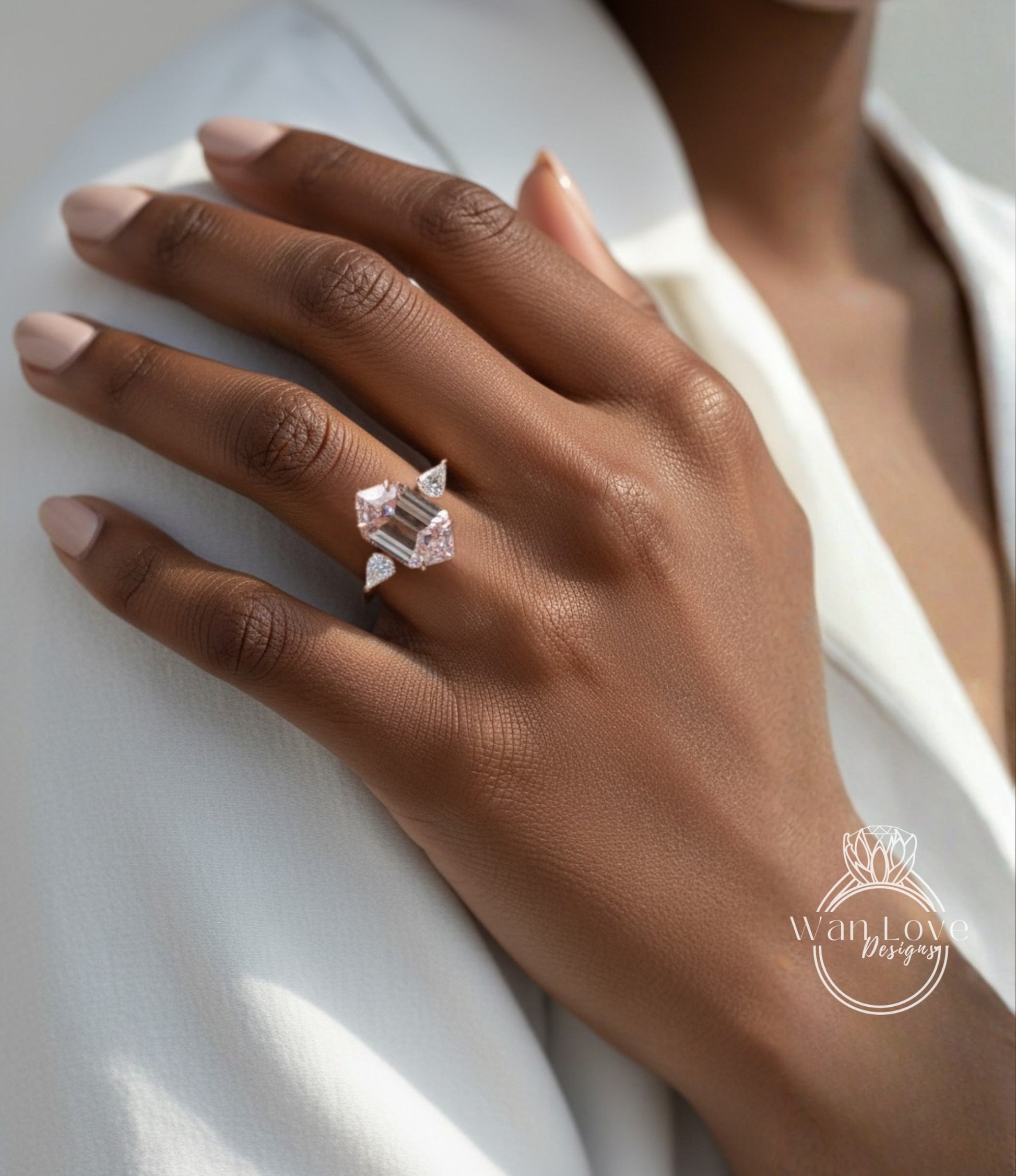 A close-up of a person's hand wearing a ring with a large, unique diamond.