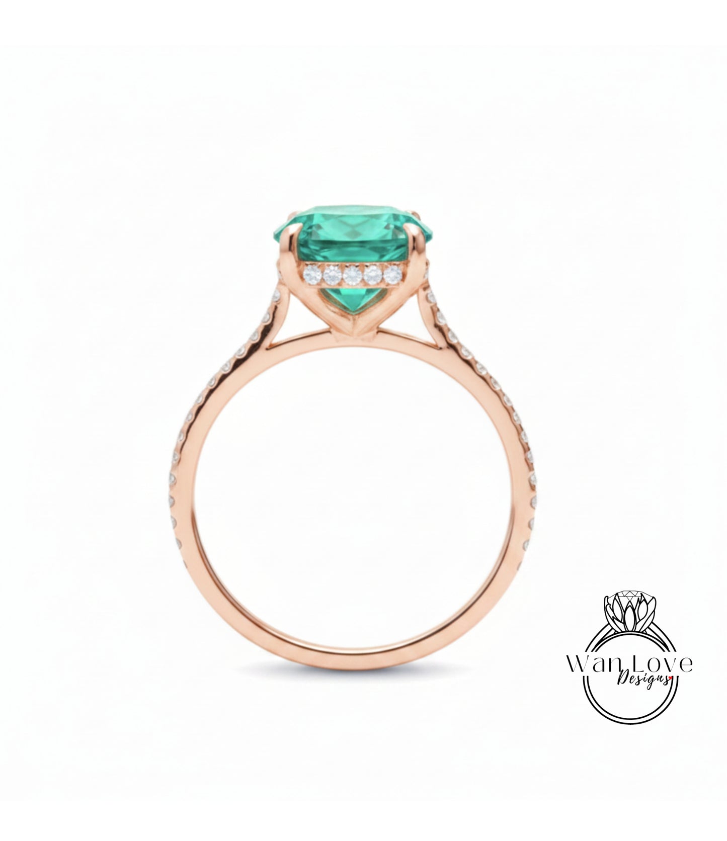 A rose gold engagement ring with a large, vibrant green gemstone set in the center, surrounded by smaller diamonds.