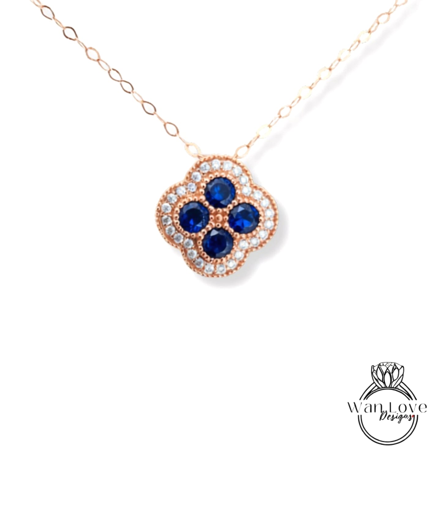 A delicate necklace with a pendant featuring a blue gemstone design.
