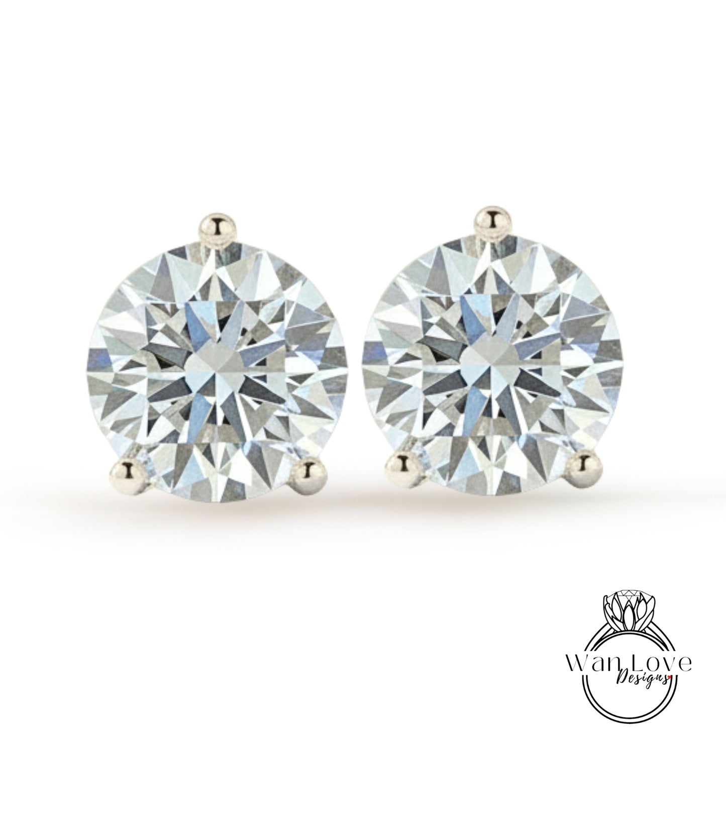 A pair of elegant diamond earrings with large, brilliant-cut diamonds set in a silver metal.
