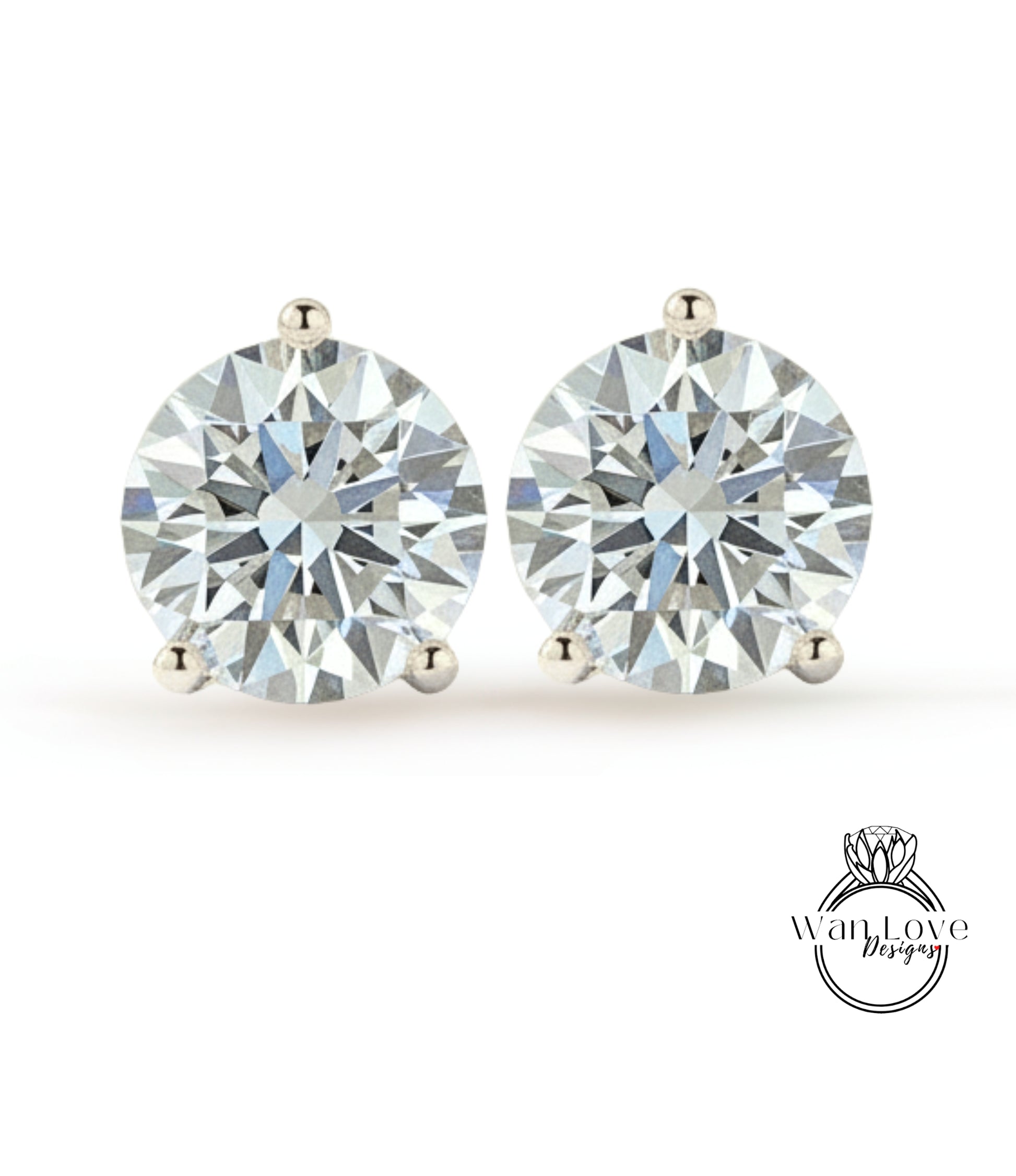 A pair of elegant diamond earrings with large, brilliant-cut diamonds set in a silver metal.