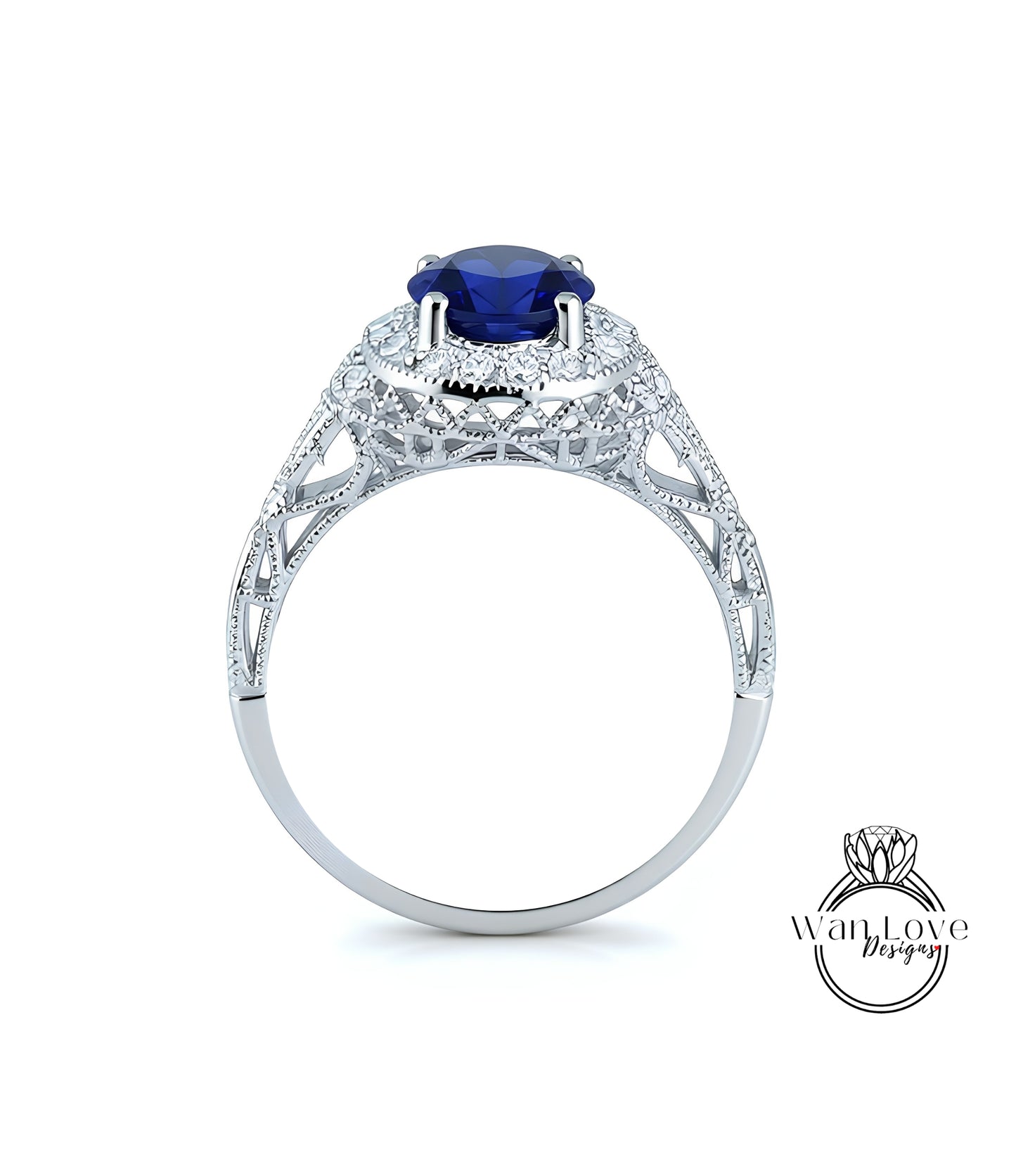 A silver ring with a large blue gemstone, possibly a sapphire, set in an intricate, ornate design.