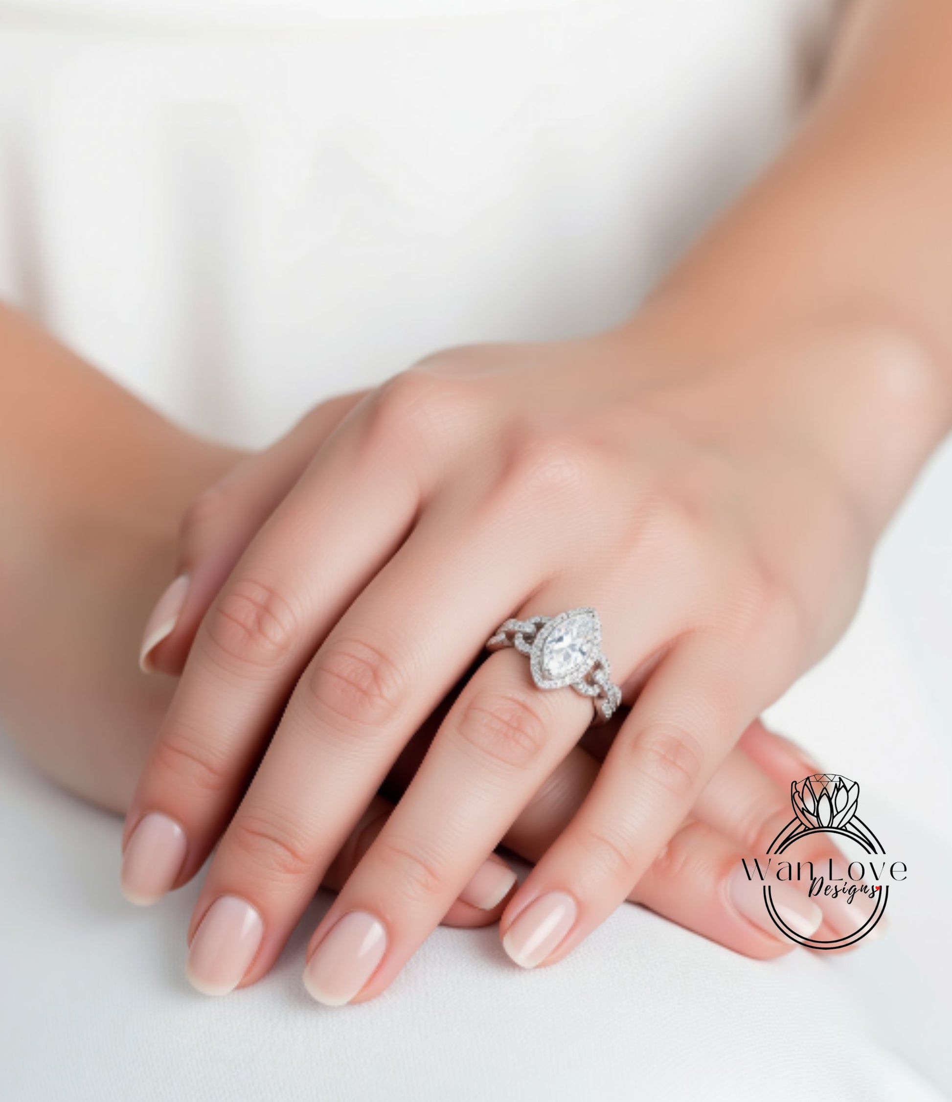 A close-up of a person's hand wearing a diamond engagement ring.