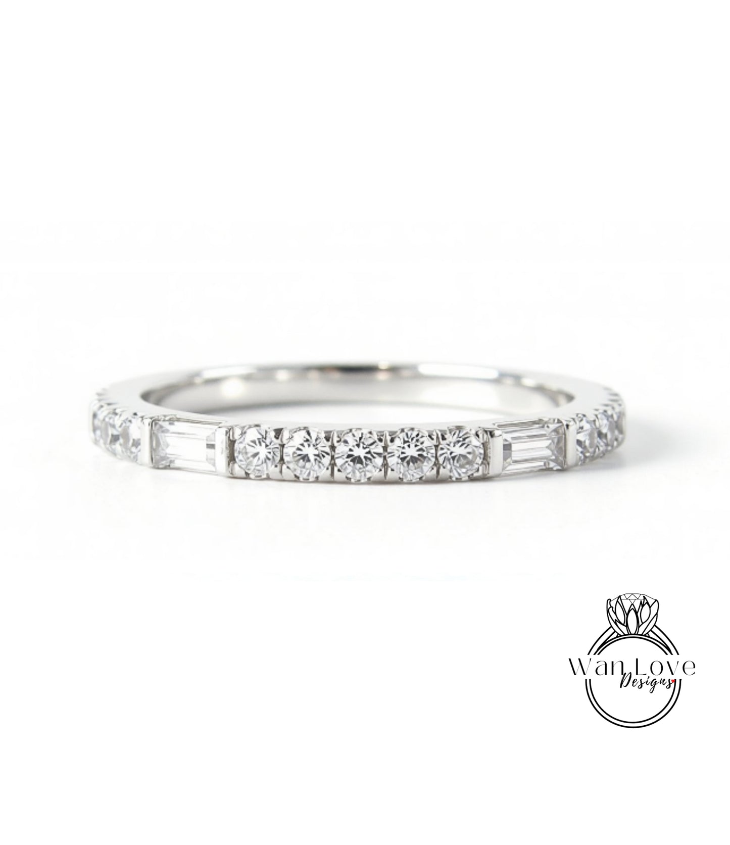 A silver band ring with a row of diamonds set in it.