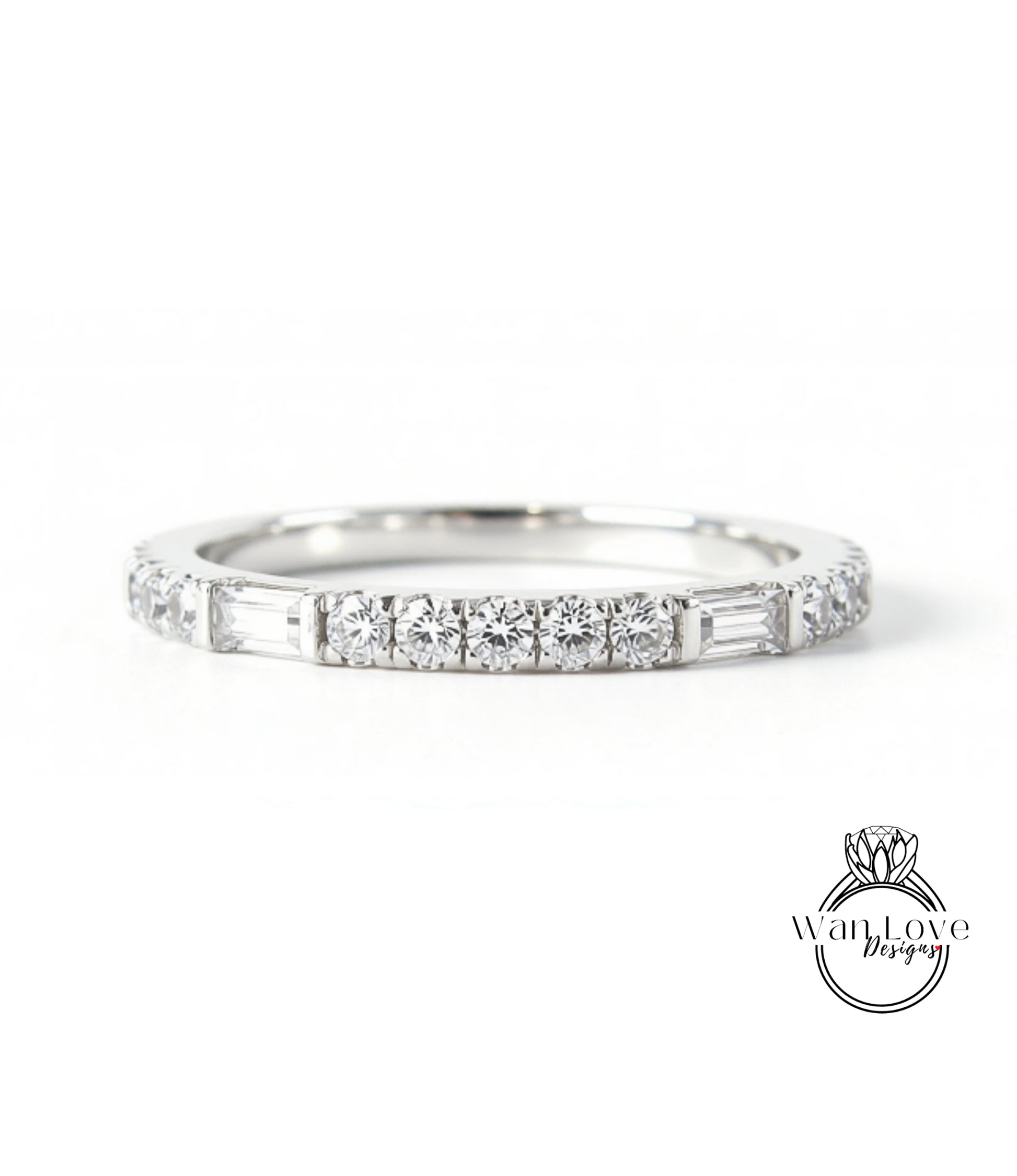 A silver band ring with a row of diamonds set in it.