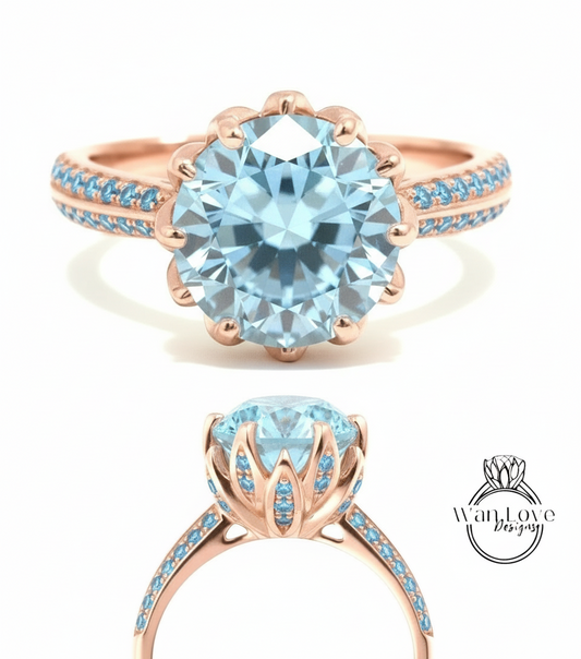 a beautiful blue gemstone ring with a large central stone surrounded by smaller stones. The ring has a rose gold band with blue stones and a delicate flower-like design.