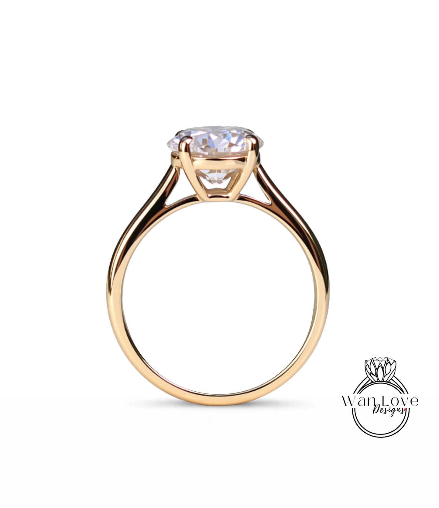 A gold engagement ring with a large diamond set in the center of the band.