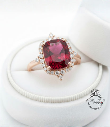 A close-up image of a beautiful red gemstone ring placed in a white jewelry box.