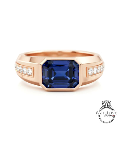 A gold ring with a large blue gemstone in the center, surrounded by smaller diamonds.