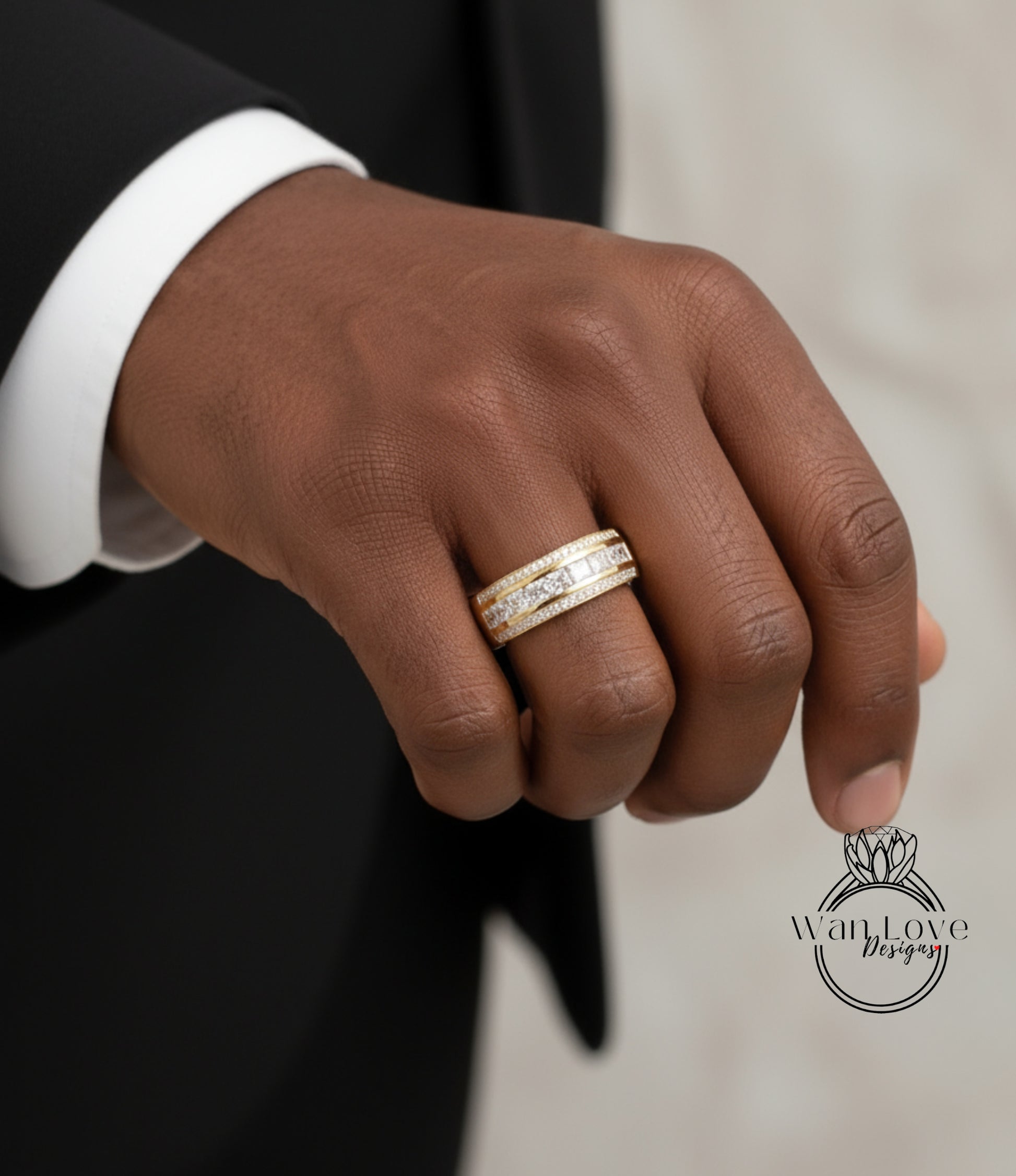 A close-up of a person's hand wearing a gold ring with a diamond band.