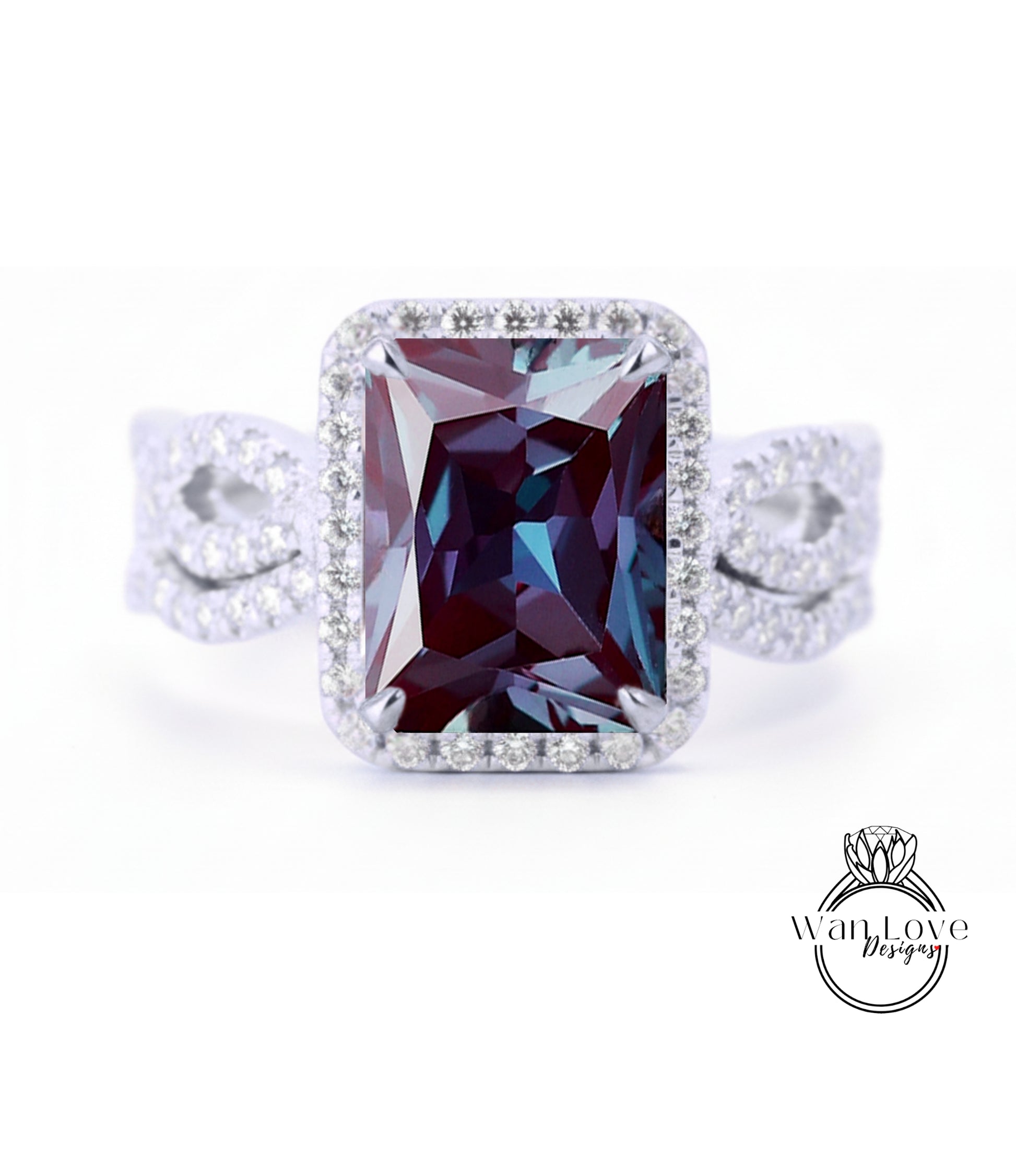 A large, rectangular purple gemstone set in a silver ring with a halo of smaller diamonds around the edges.