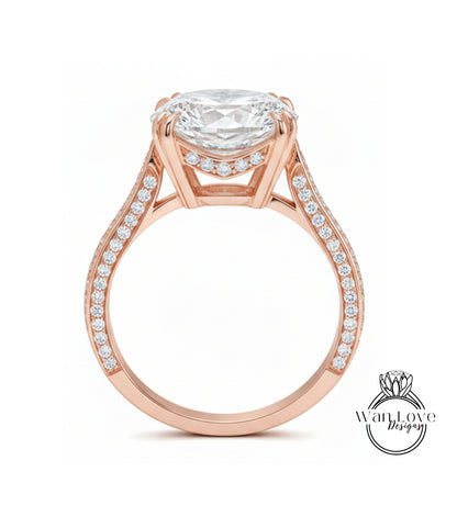 A large, elaborate gold ring with a large central diamond and smaller diamonds along the band.