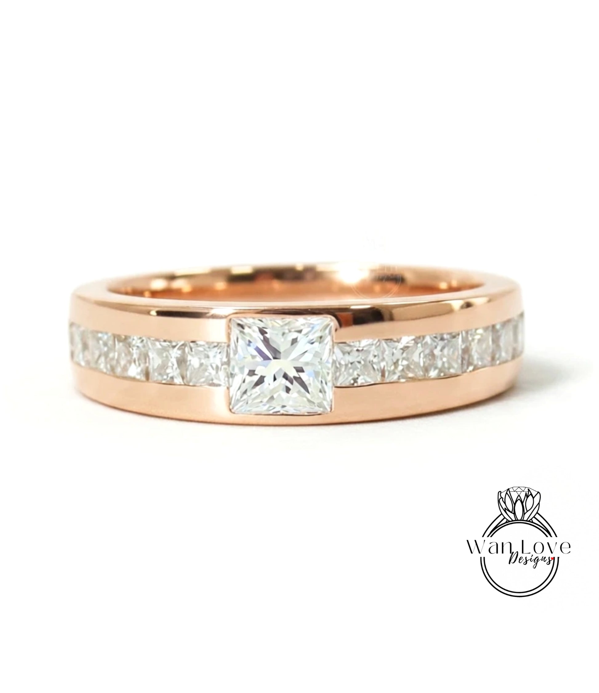 A rose gold ring with a large central diamond and smaller diamonds along the band.