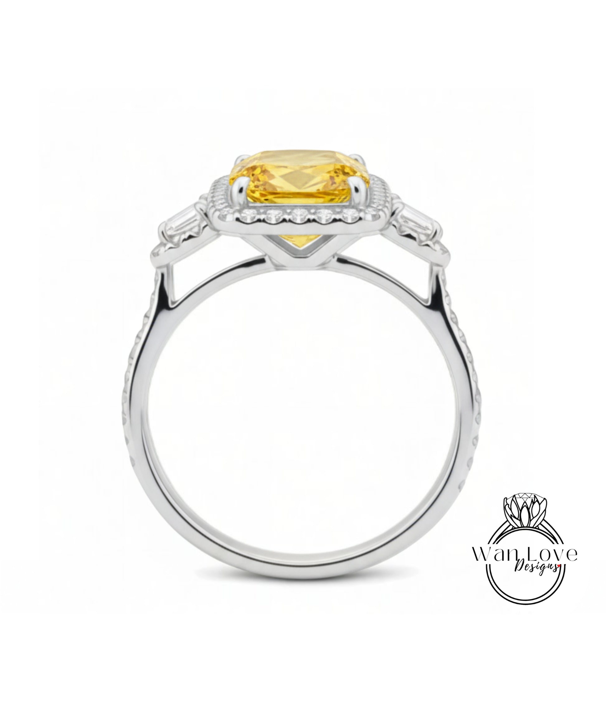 A silver ring with a large yellow gemstone, likely a diamond, set in the center.