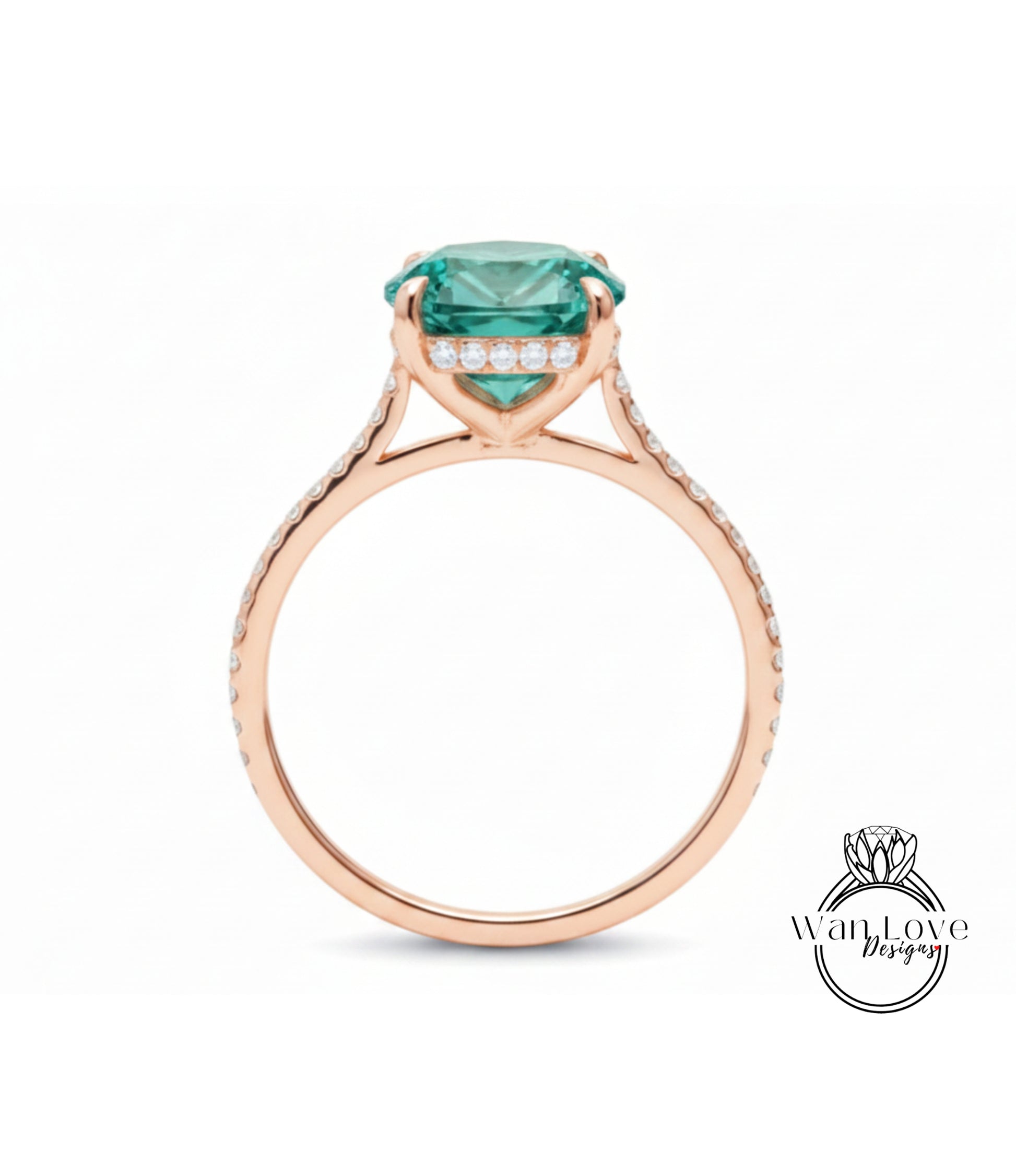 A rose gold engagement ring with a large, round, green gemstone set in the center, surrounded by smaller diamonds.