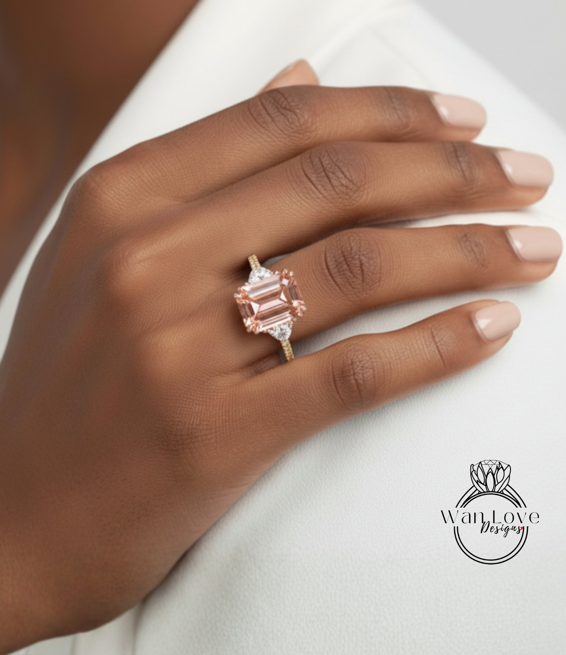 A close-up of a person's hand wearing a large, pink gemstone engagement ring.