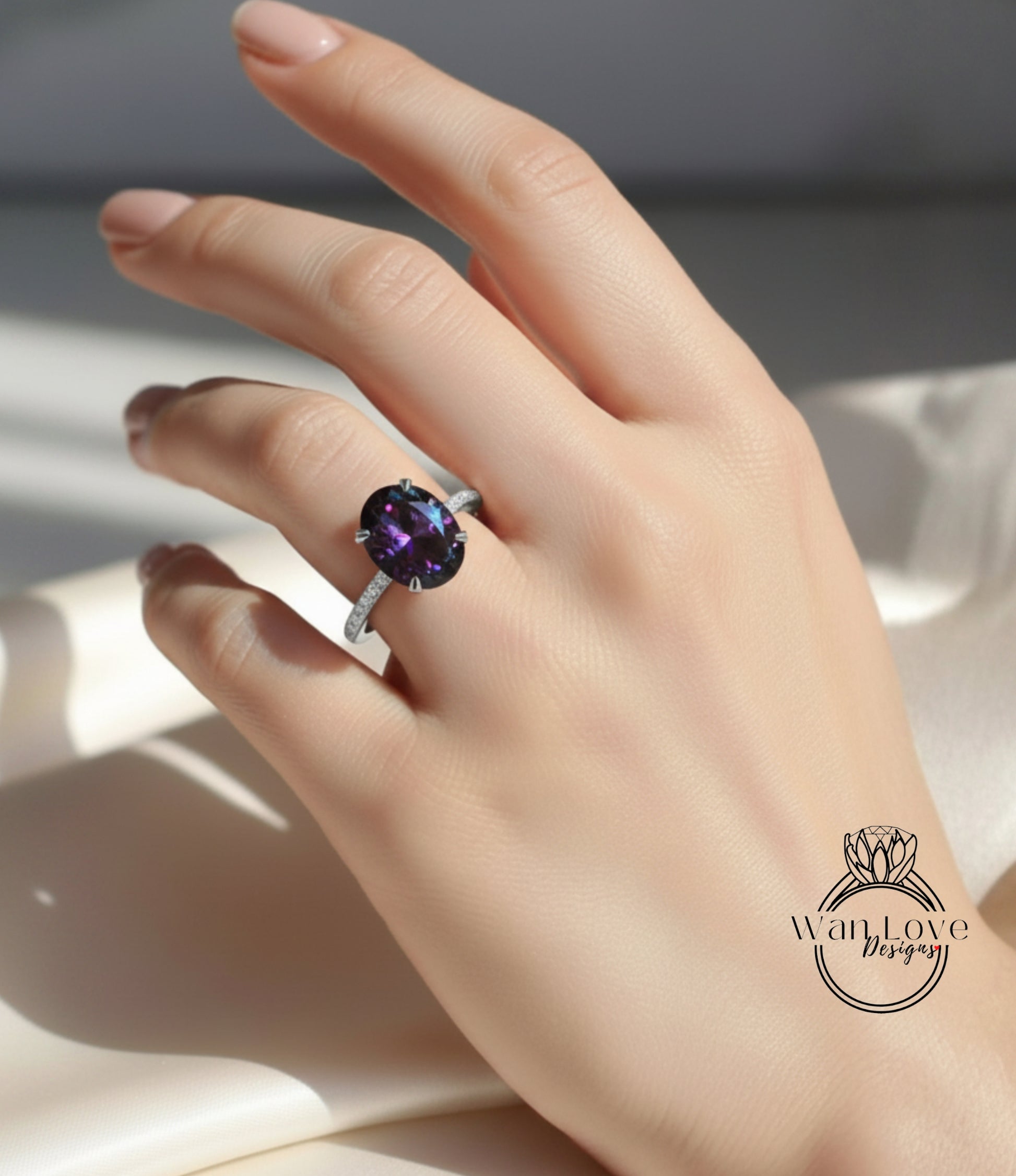 A close-up of a hand wearing a ring with a large purple gemstone, likely an oval-shaped purple gemstone.