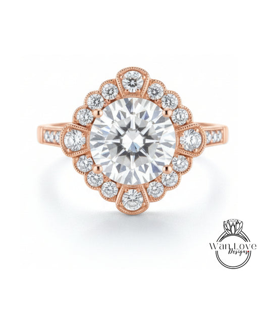 a beautiful engagement ring with a large central diamond surrounded by smaller diamonds arranged in a fan-like pattern.