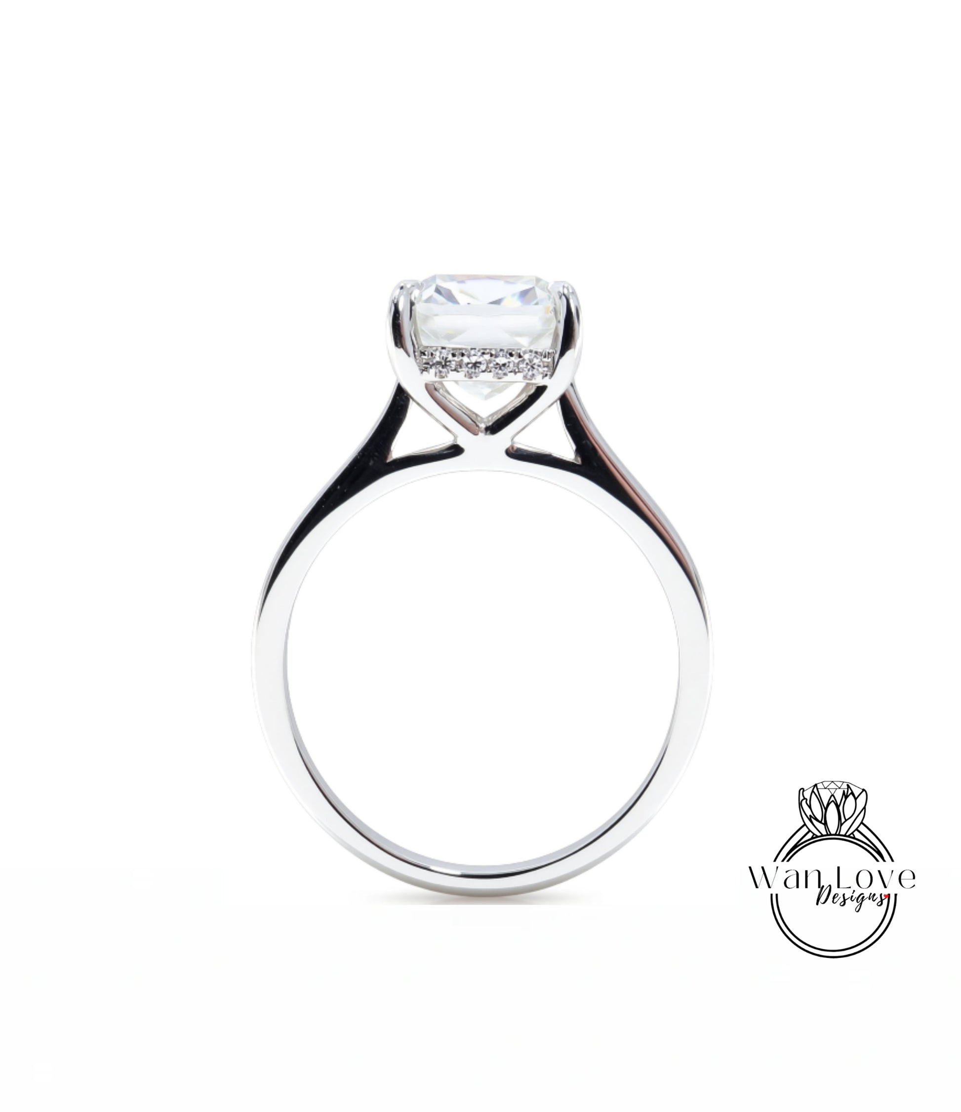 A silver engagement ring with a large, clear gemstone set in the center of the band.