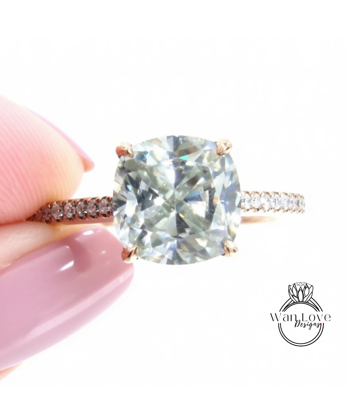 A close-up image of a person's hand holding a diamond engagement ring with a large, clear gemstone set in a gold band.