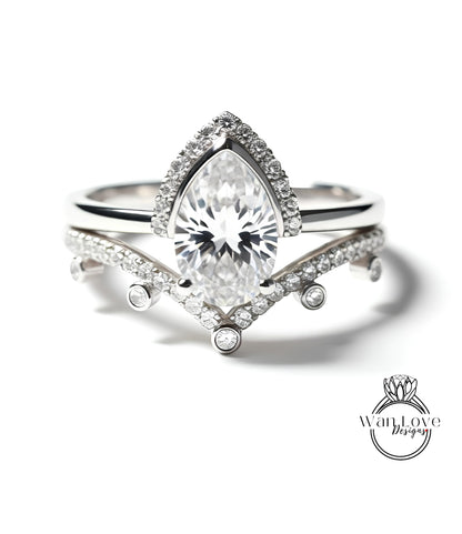 A close-up of a diamond engagement ring with a large central diamond surrounded by smaller diamonds on the band.