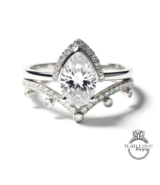 A close-up of a diamond engagement ring with a large central diamond surrounded by smaller diamonds on the band.