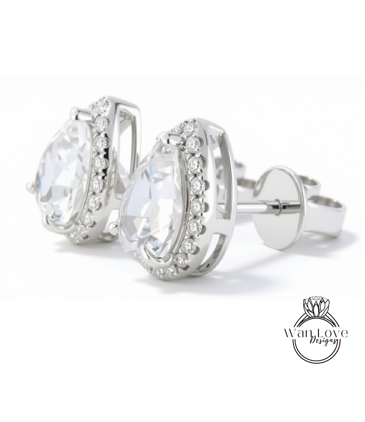 A pair of elegant silver earrings with large, clear gemstones set in a halo-like design.