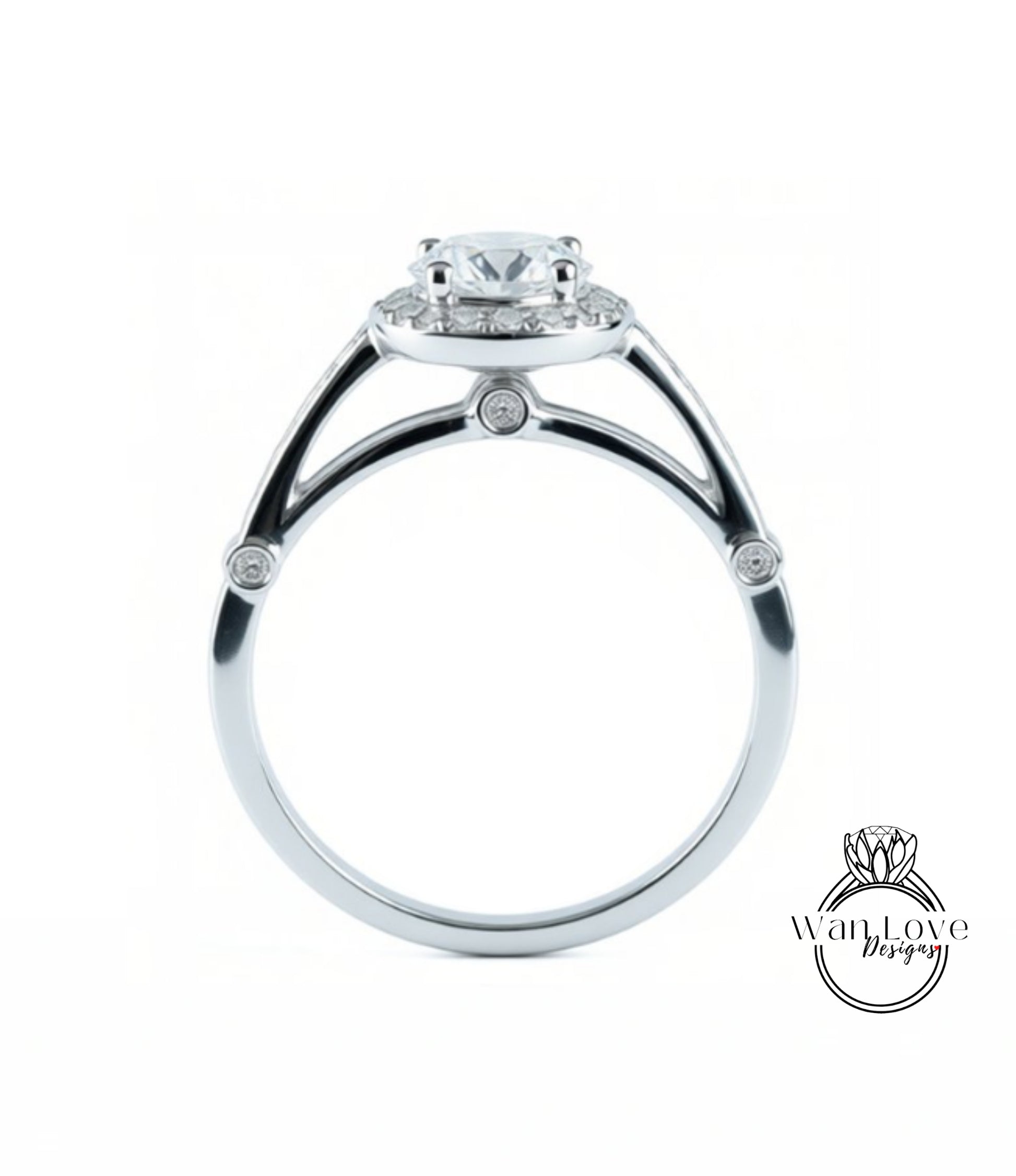 A silver engagement ring with a large central diamond and smaller diamonds around the halo.
