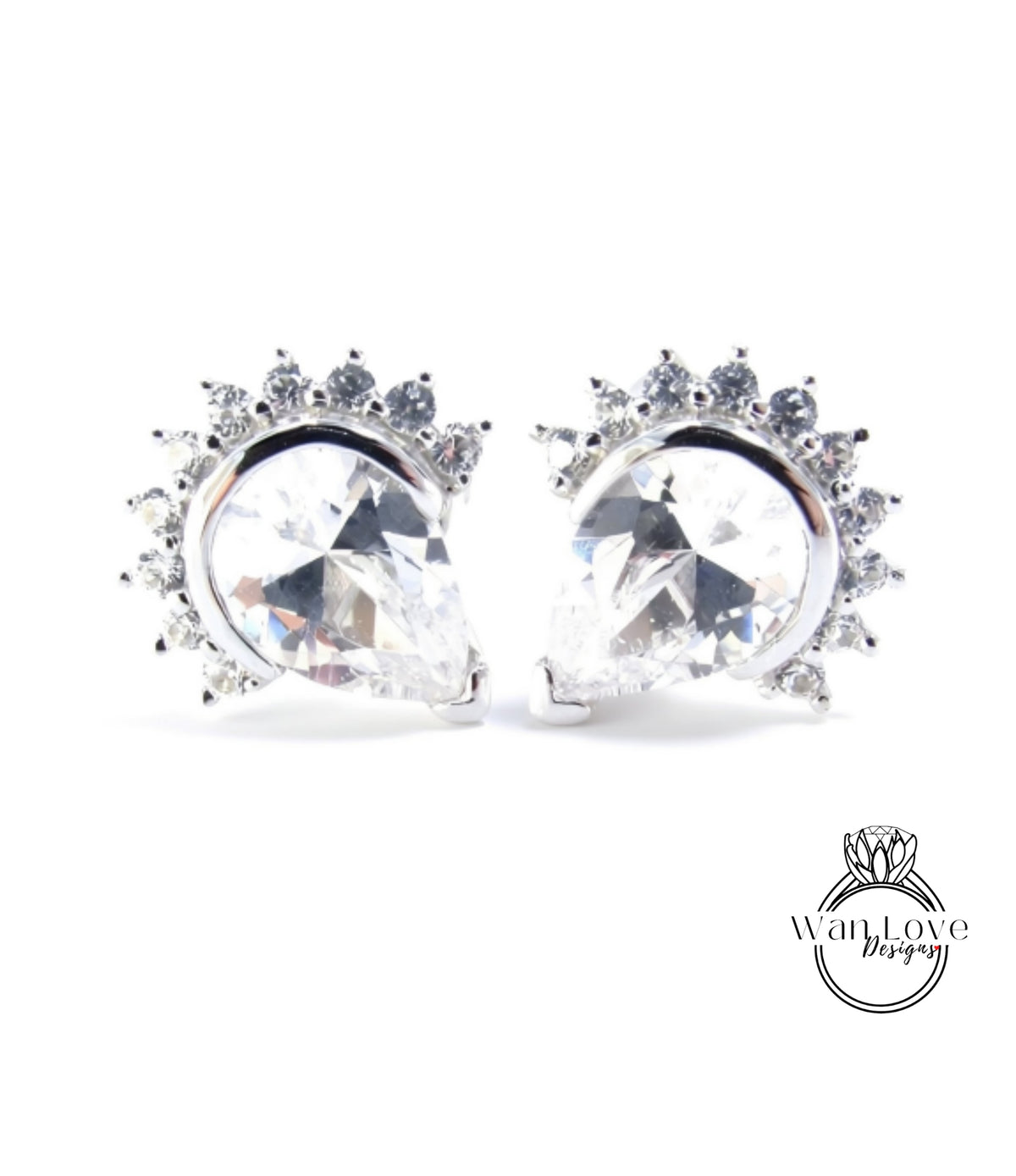 A pair of elegant earrings with large, clear gemstones set in a silver frame, creating a sparkling and sophisticated design.
